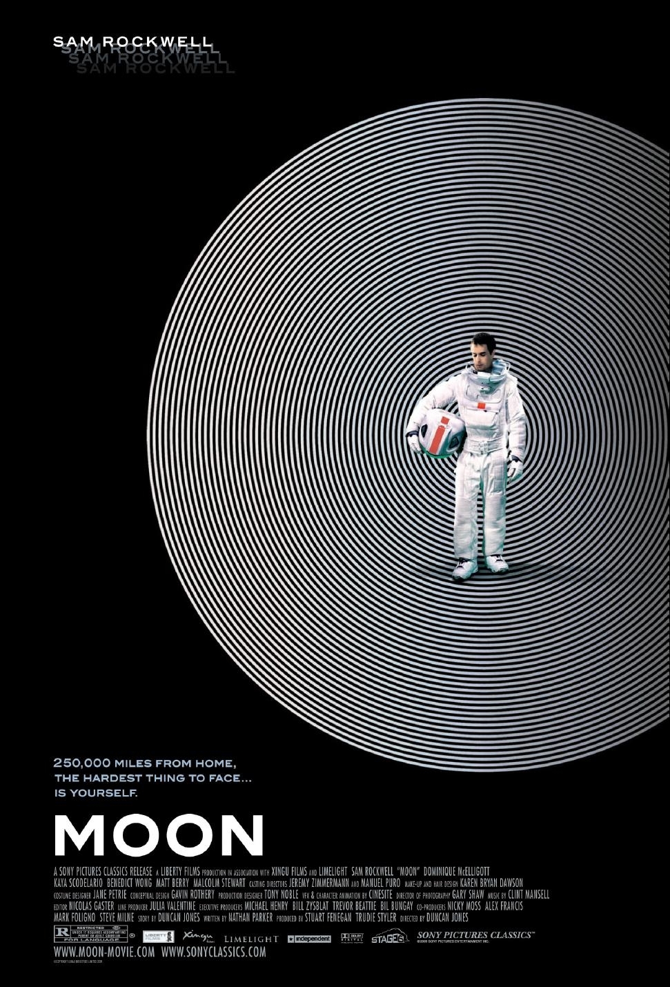 The movie poster for Moon. All black, apart from some concentric black and white circles with Sam Rockwell in a spacesuit standing in front of them. Tagline: "250,000 miles from home, the hardest thing to face... is yourself."