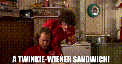 Weird Al offering his friend Bob a Twinkie Wiener Sandwich